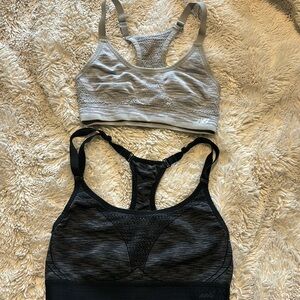 Size M black AVIA sports bra and size M grey New Balance sports bra
